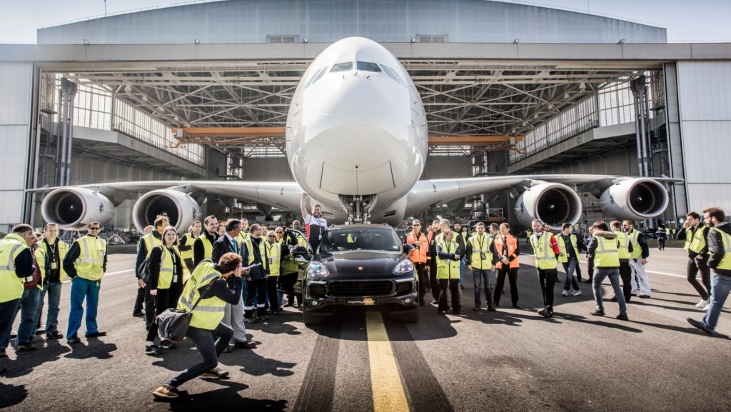 Porsche Cayenne S Diesel pulls one of Air France's 285 tonne A380 at Charles de Gaulle Airport in Paris - Both Vehicles & Crew