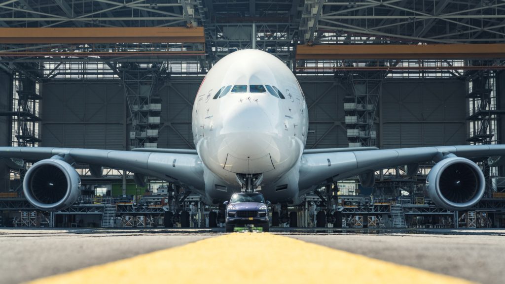 Porsche Cayenne S Diesel pulls one of Air France's 285 tonne A380 at Charles de Gaulle Airport in Paris - Front View