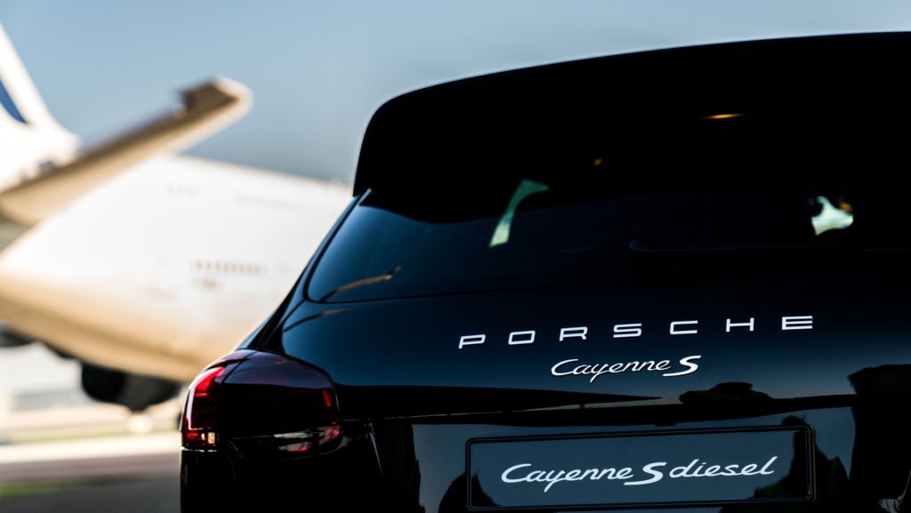 Porsche Cayenne S Diesel pulls one of Air France's 285 tonne A380 at Charles de Gaulle Airport in Paris - Rear View