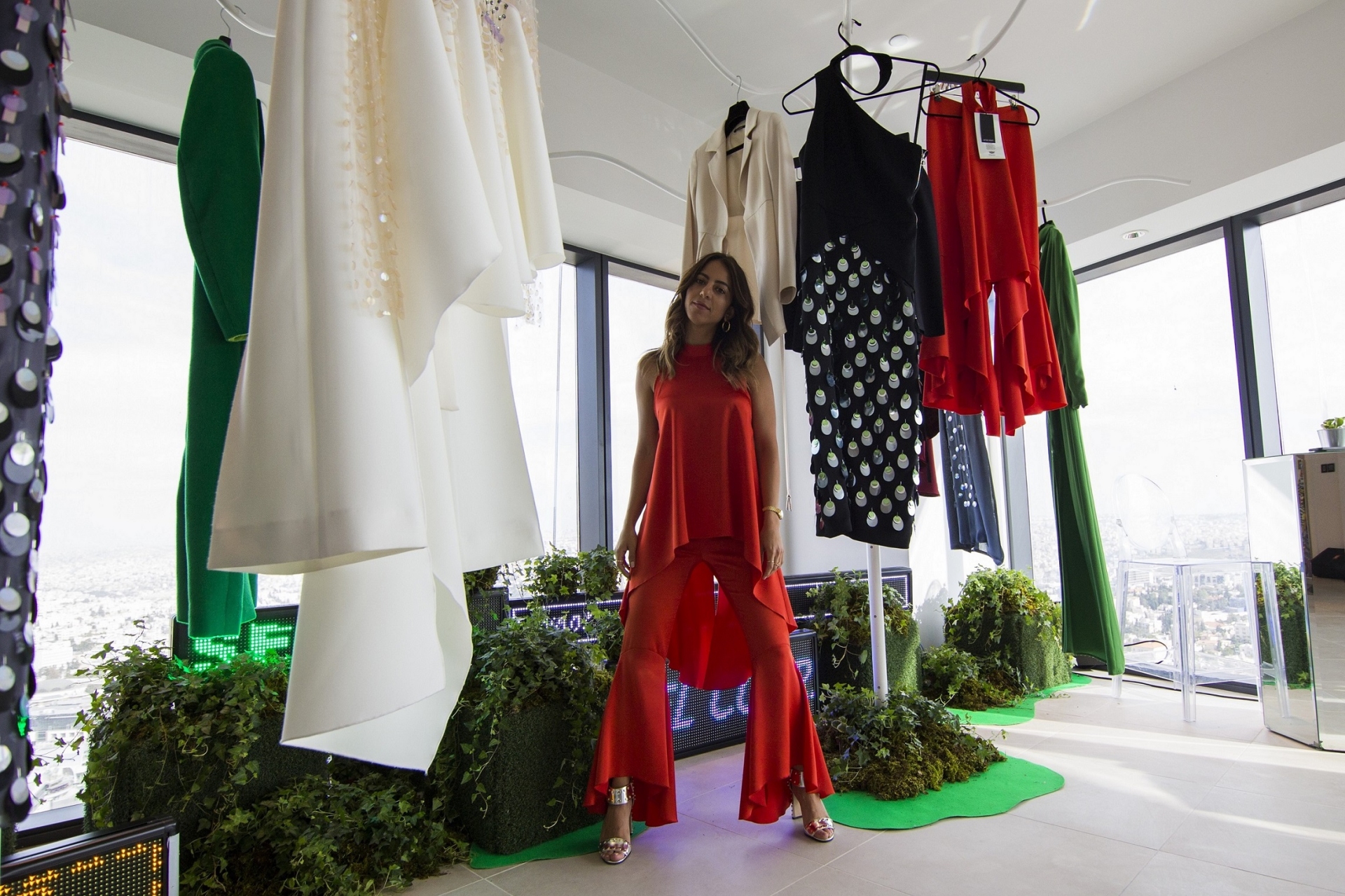 Cadillac Commissions Jordanian designer Nafsika Skourti To Fashion Piece - Model With Red Outfit