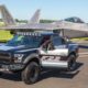 Ford F-150 Raptor F-22 Concept along side Lockheed Martin F-22 Raptor - Black Exterior - Front Side View - Open Door