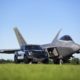 Ford F-150 Raptor F-22 Concept along side Lockheed Martin F-22 Raptor - Black Exterior - Front Side View - Zoomed out