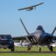 Ford F-150 Raptor F-22 Concept along side Lockheed Martin F-22 Raptor - Black Exterior - Front View