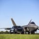 Ford F-150 Raptor F-22 Concept along side Lockheed Martin F-22 Raptor - Black Exterior - Front View - Zoomed Out