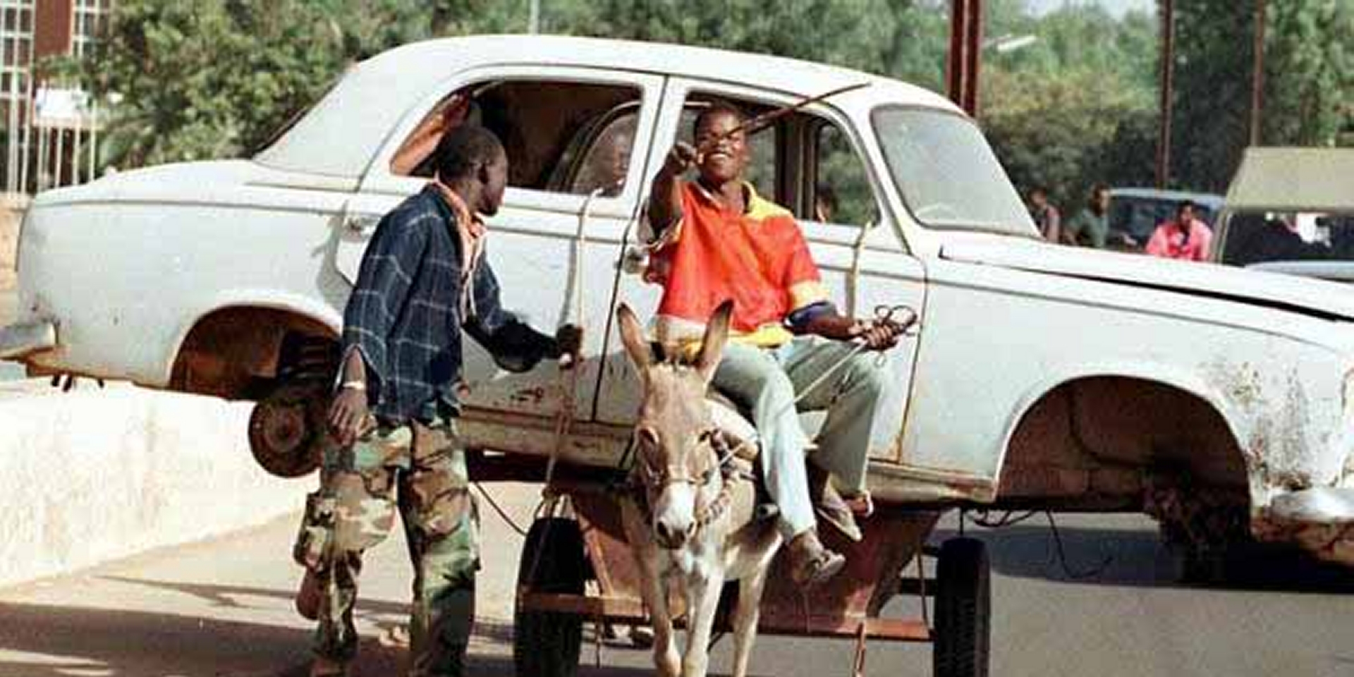 10 Vehicles Overloaded To A Point Of Being Ludicrous - Man on a mule carrying a car